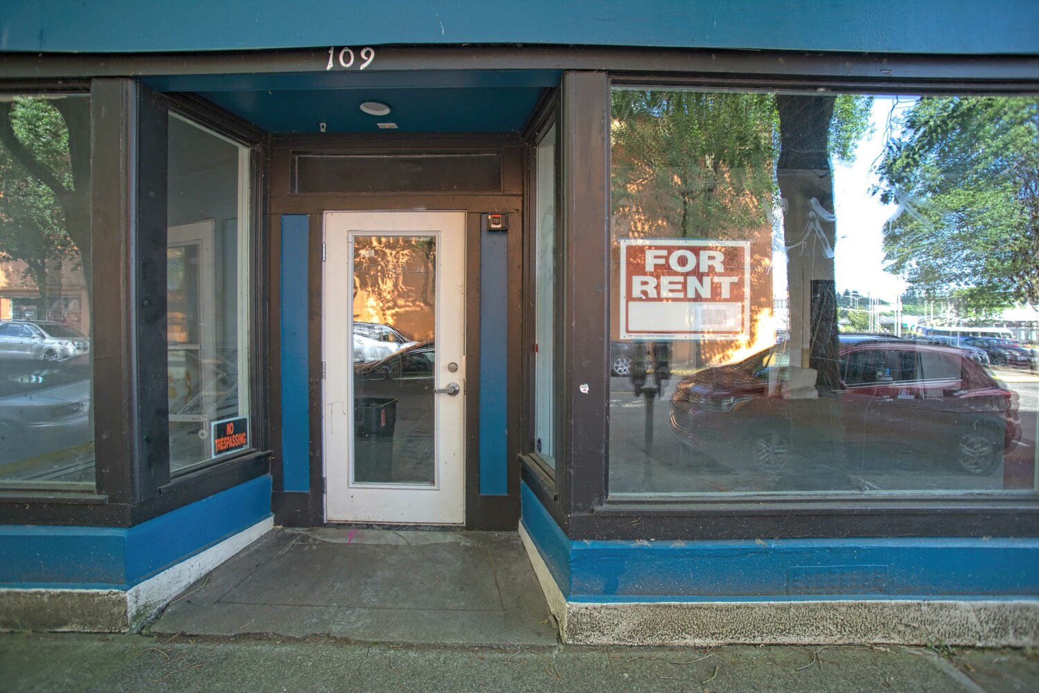 Much of the downtown area of Olympia is comprised of cracked and broken sidewalks, trespassers on private property, garbage in alleys and outside of businesses, dirty streets, and empty storefronts. Shown is a building for rent.